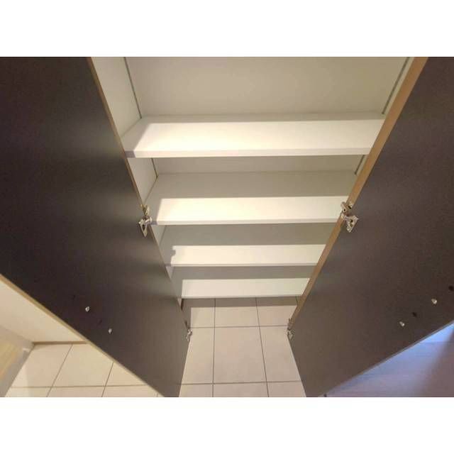 ����16