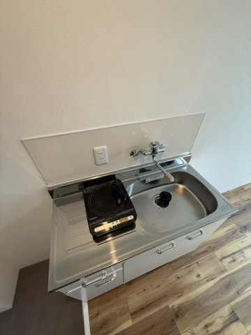 ����16